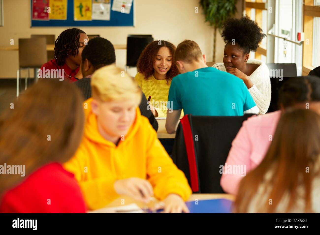 College students studying together in classroom Stock Photo
