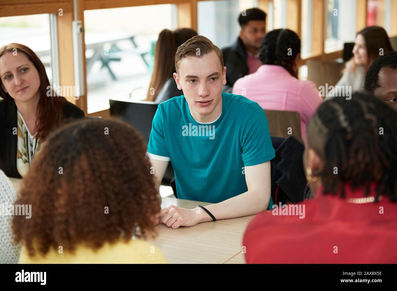 College students talking in classroom Stock Photo