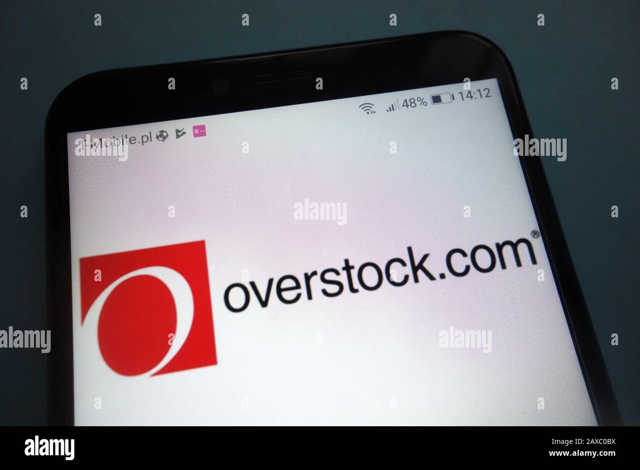 Overstock logo on smartphone Stock Photo