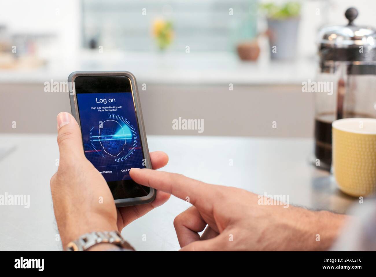 Close up man using smart phone facial recognition log on Stock Photo
