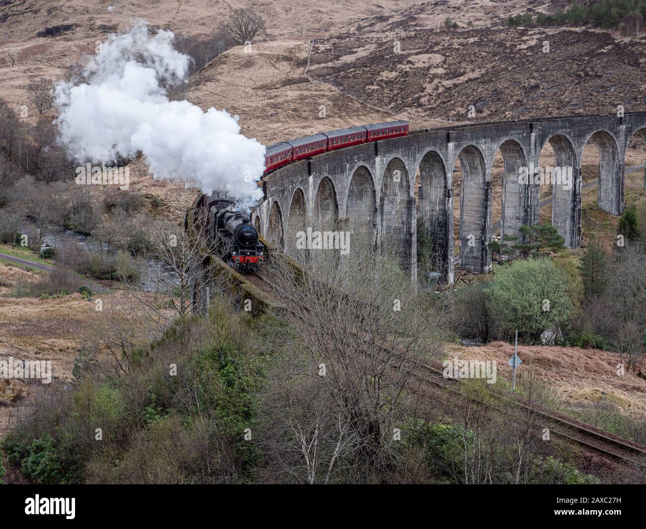 The Jacobite Steam Train Crossing Glenfinnan Viaduct En Route From