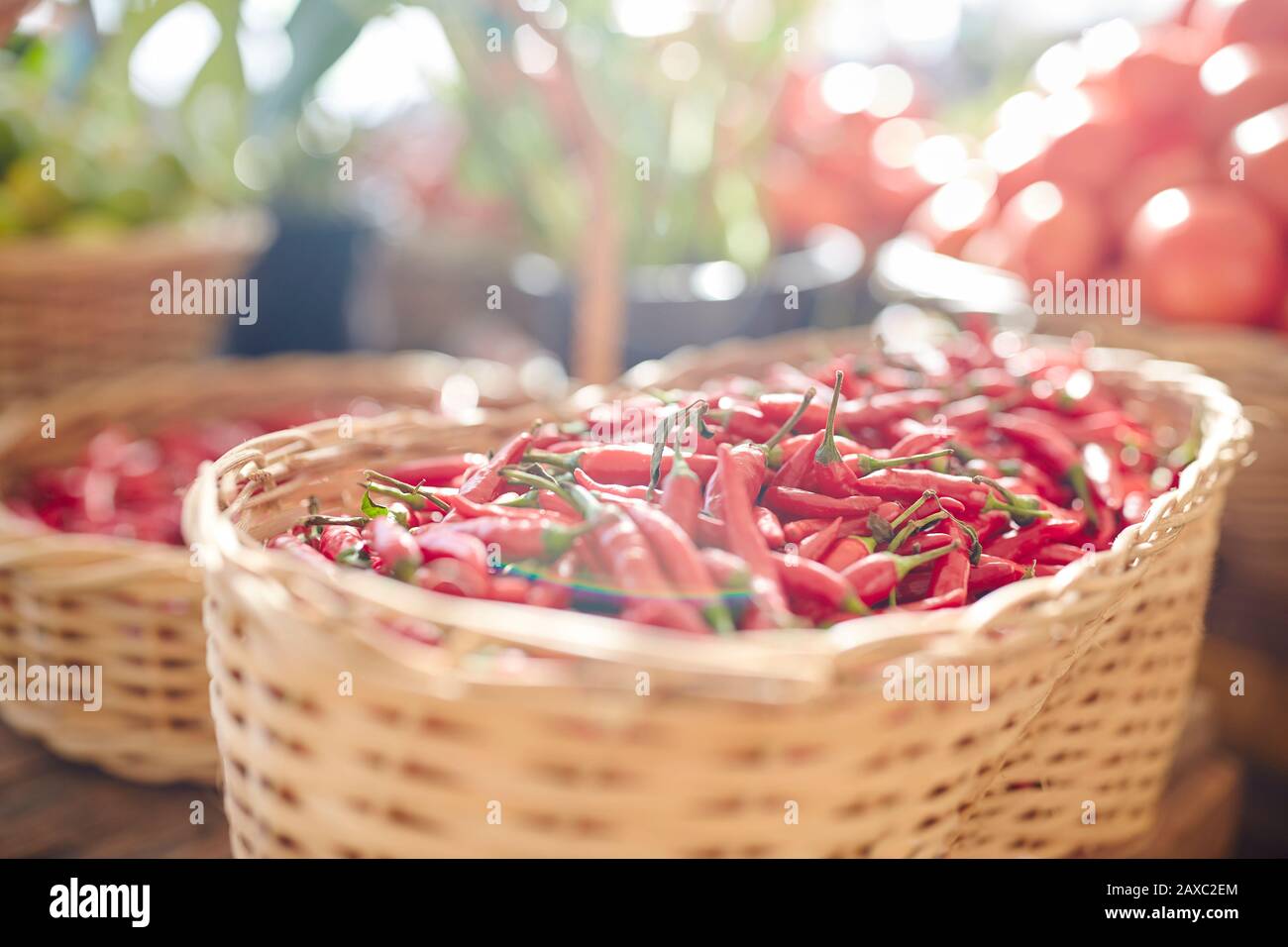 Fresh red chili peppers in basket Stock Photo