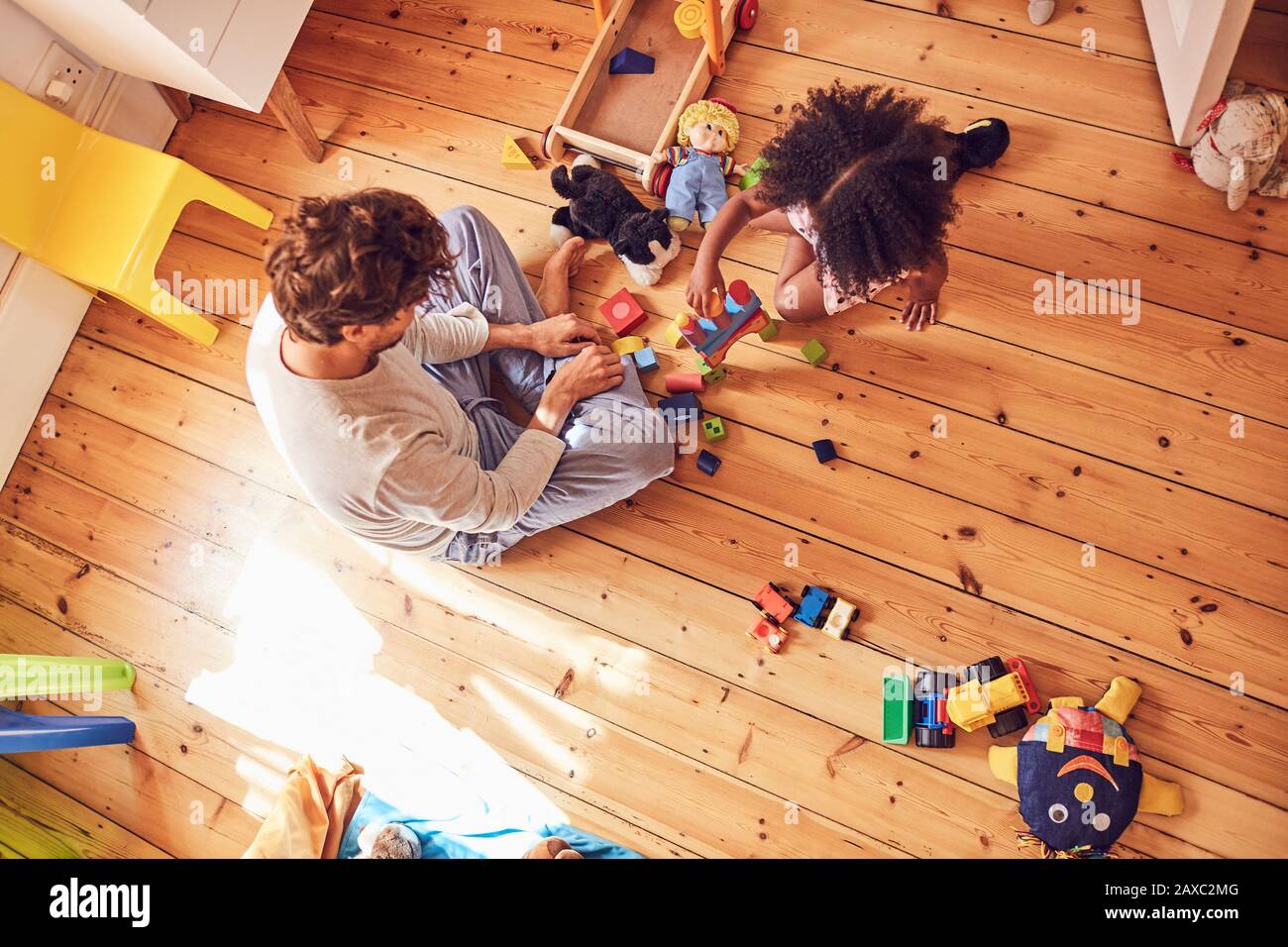 Father and daughter playing with wood blocks Stock Photo