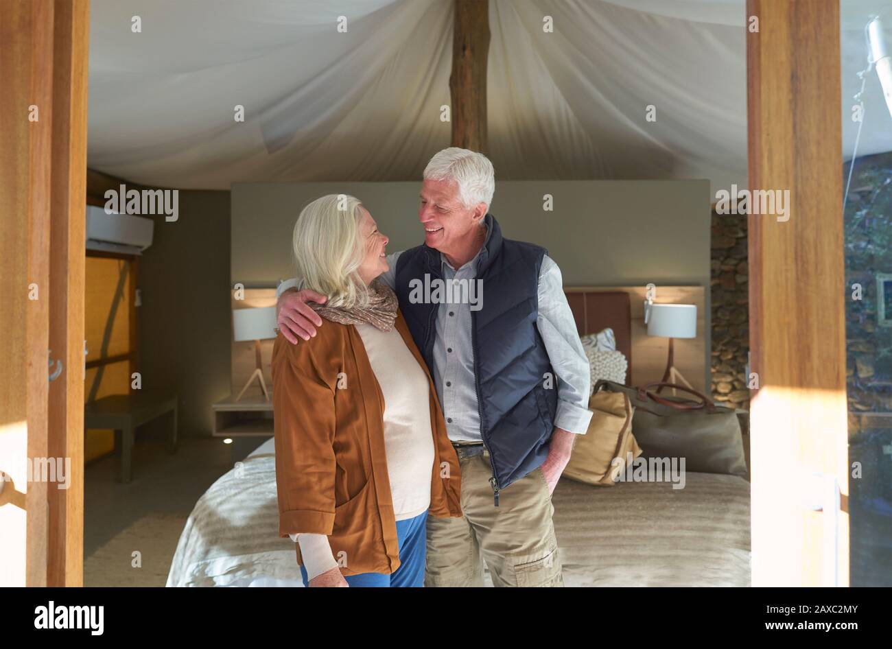 Happy senior couple in safari lodge hotel room Stock Photo