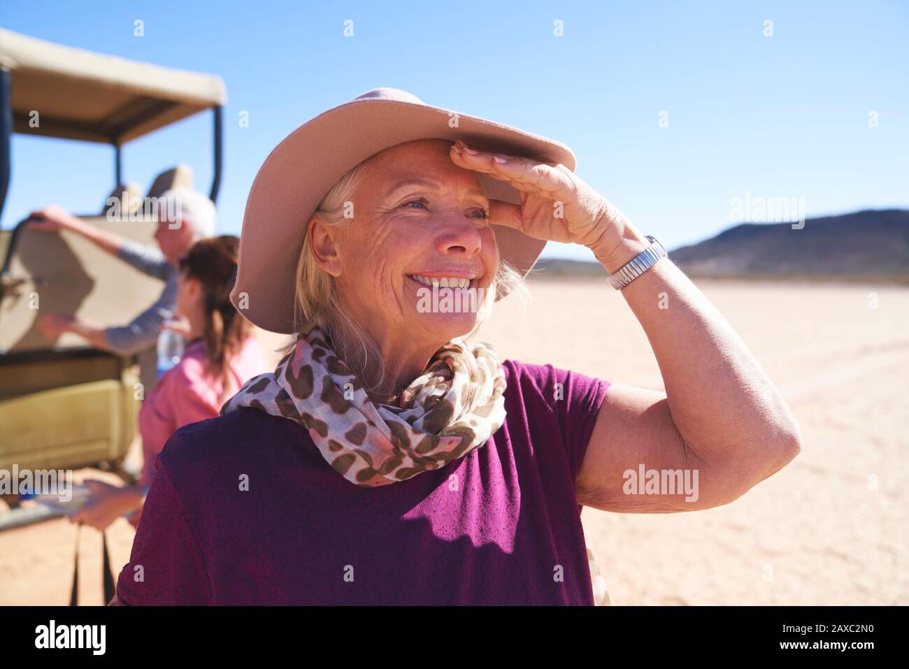 Portrait happy senior woman on safari Stock Photo