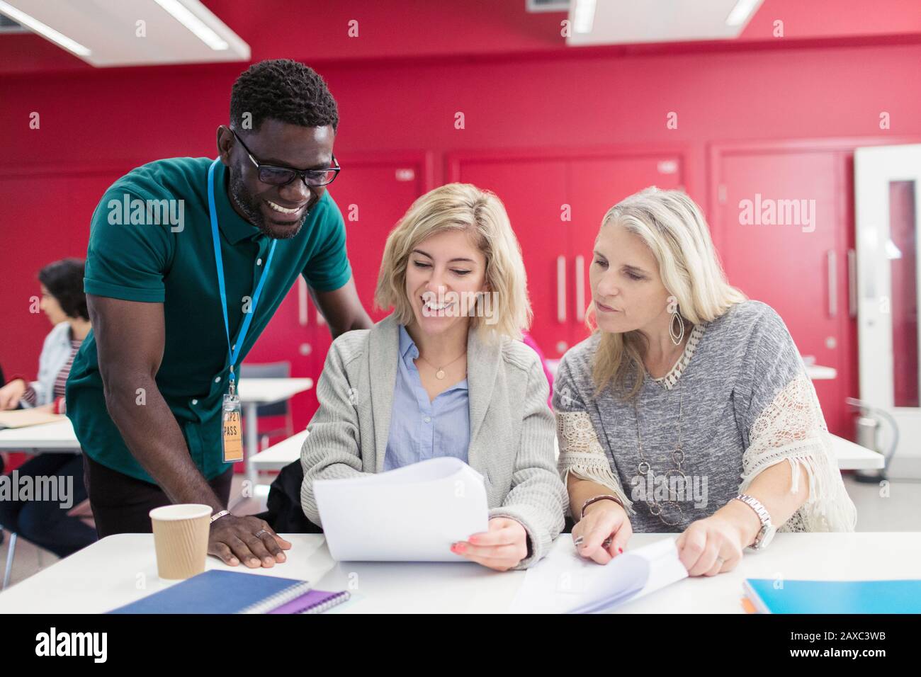 Student Pretending Not To Listen To His Teacher Standing Near Him Stock  Image - Image of classroom, discussion: 139587523