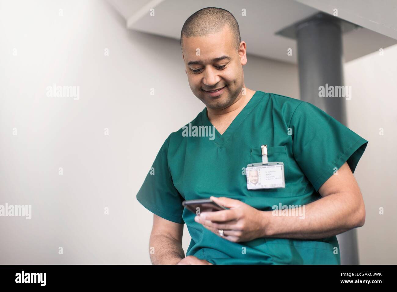 Male surgeon using smart phone Stock Photo