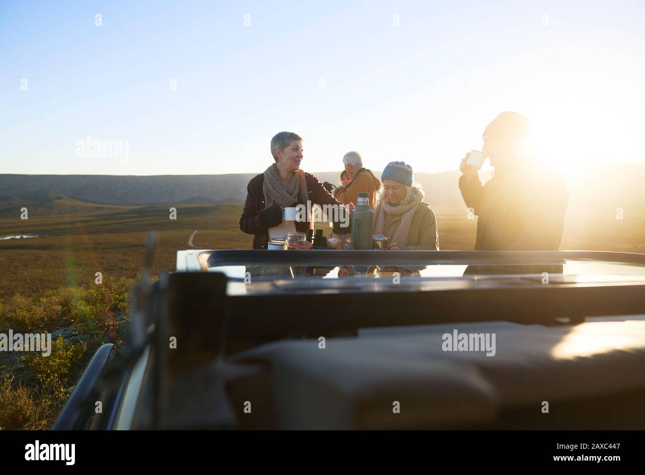 Safari tour group drinking tea at sunrise South Africa Stock Photo