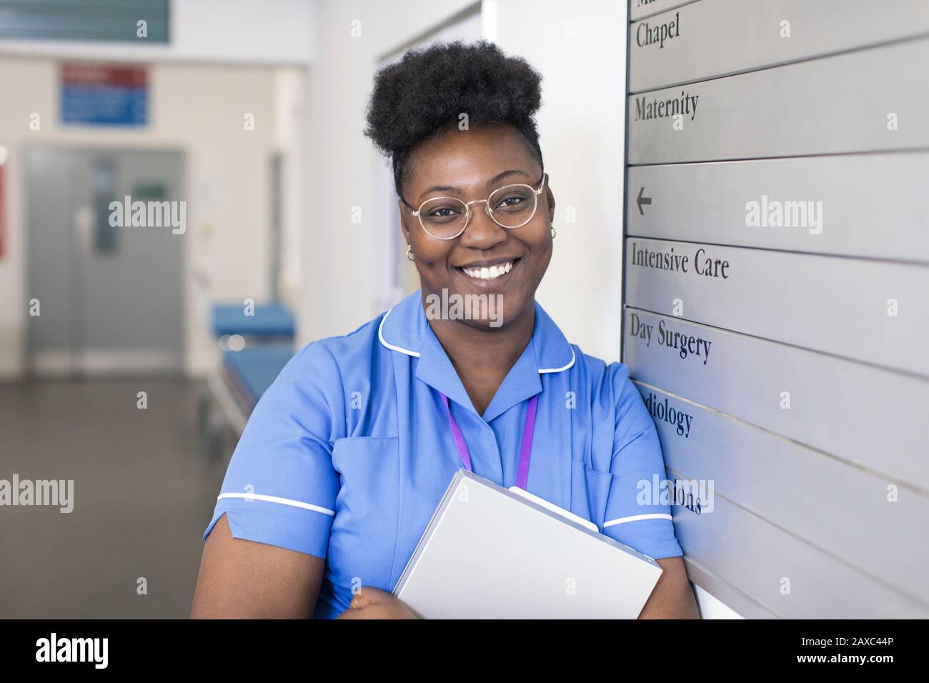 Portrait smiling, confident female nurse in hospital corridor Stock ...