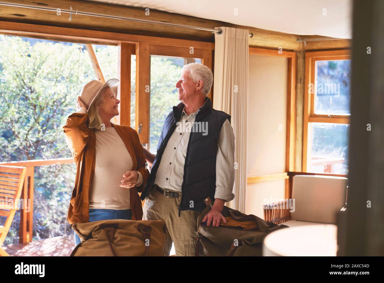 Happy playful senior couple in safari lodge hotel room Stock Photo