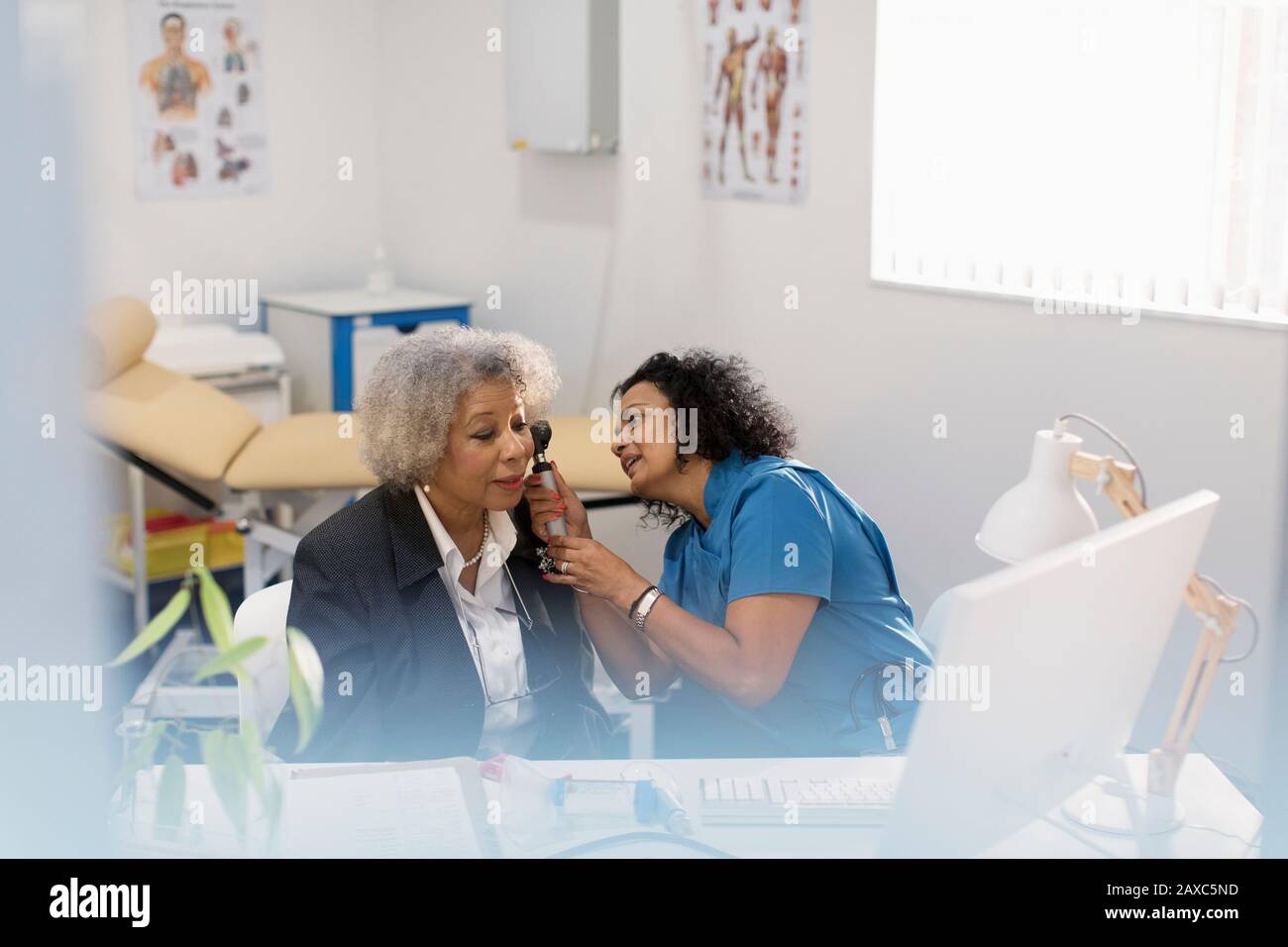 Mature woman doctors office hi-res stock photography and images - Alamy