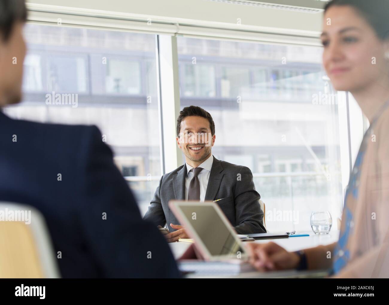 Portrait smiling, confident businessman in conference room meeting Stock Photo