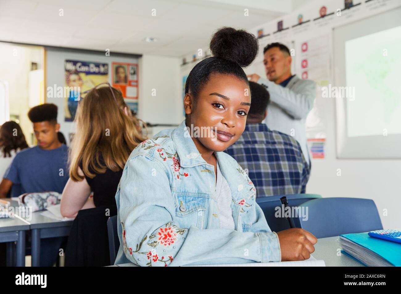 Portrait confidant high school girl student studying in classroom Stock Photo