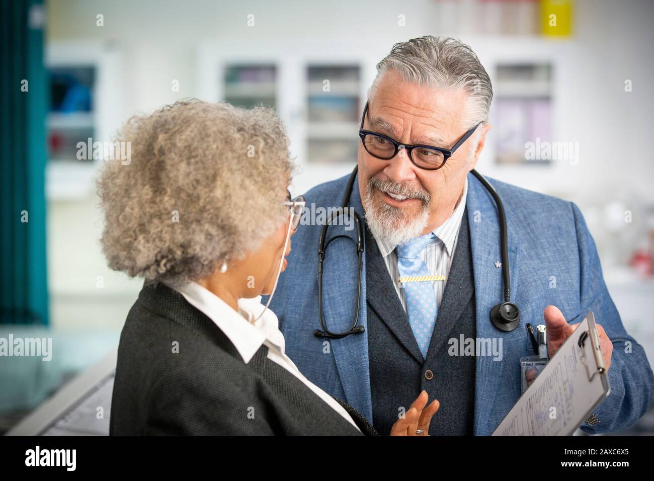 Senior doctors consulting in clinic Stock Photo