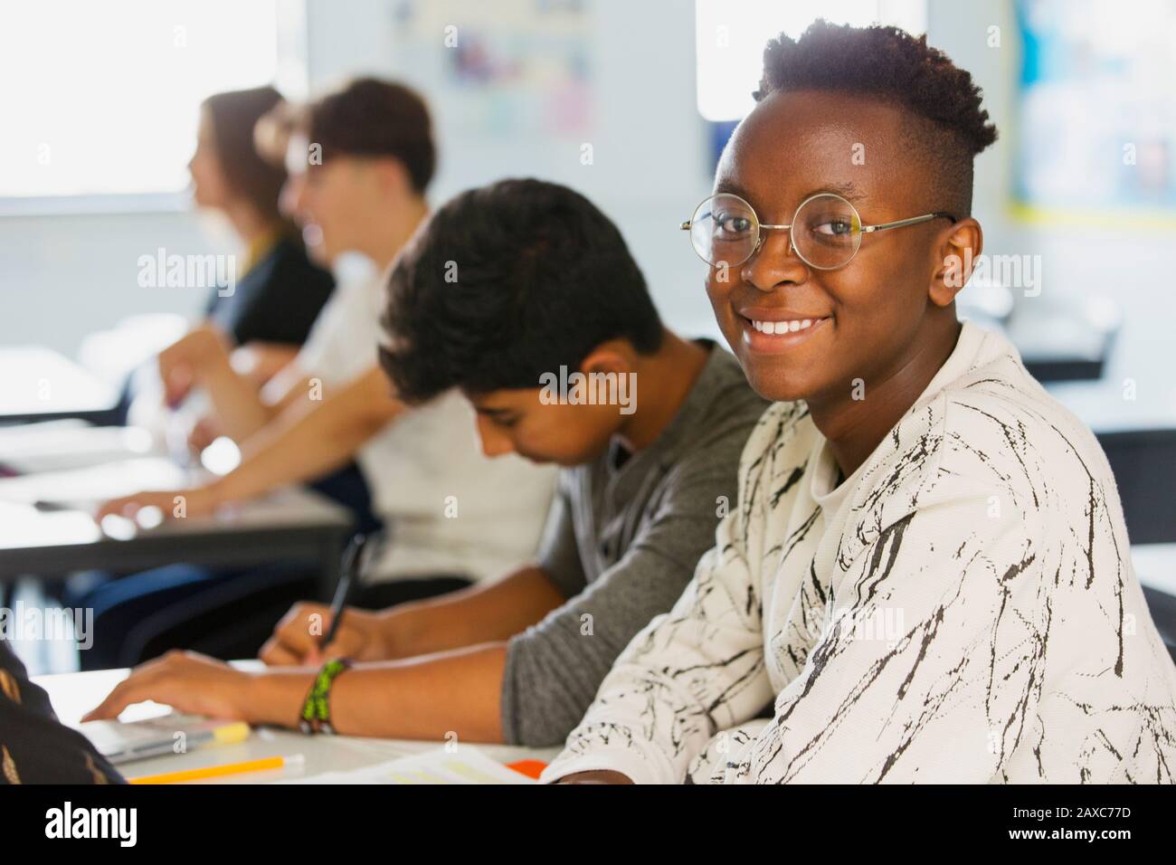 Portrait confident high school boy student in classroom Stock Photo