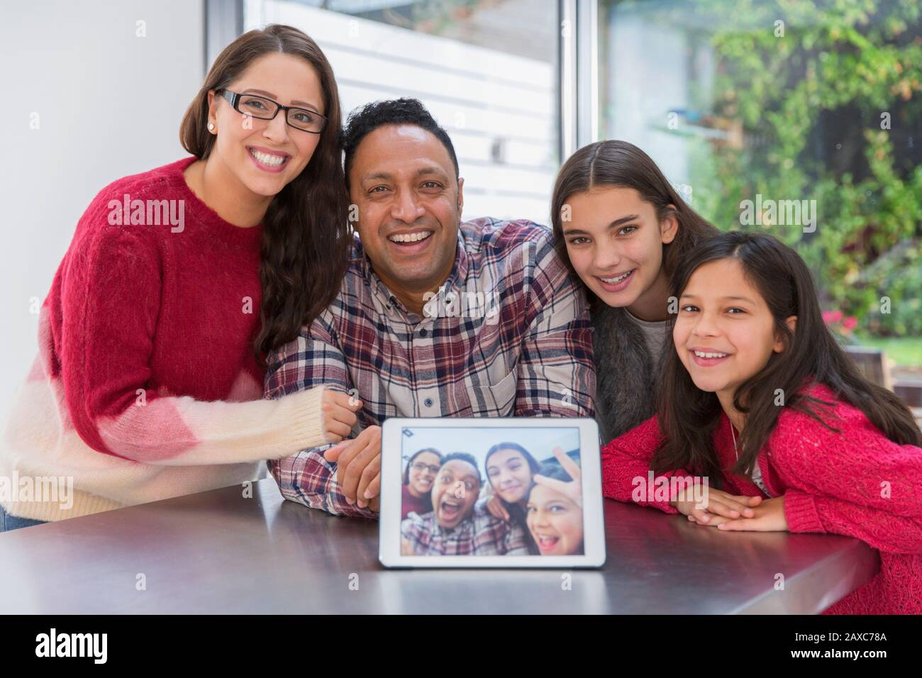 Portrait happy family with digital tablet selfie Stock Photo