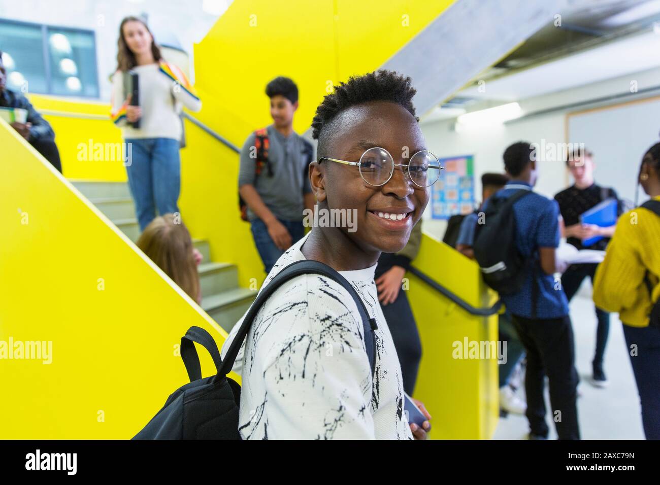Portrait confident junior high boy student in corridor Stock Photo