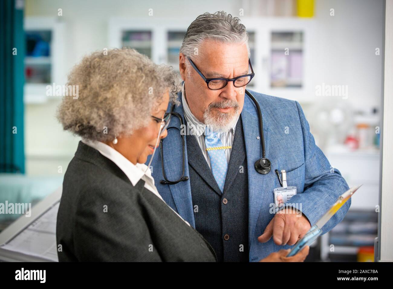 Senior doctors using digital tablet in hospital Stock Photo
