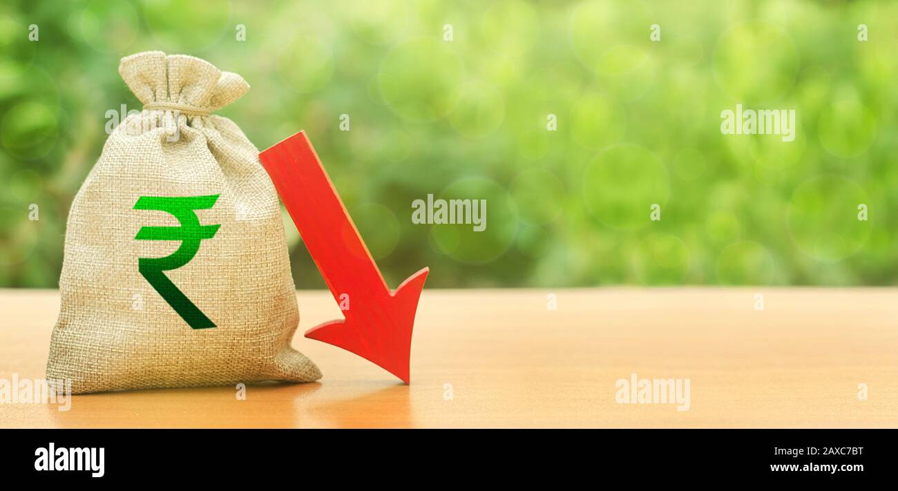 Indian rupee money bag and red arrow down. Economic decline difficulties. Deposit interest rate reduction. Depreciation of national currency. Influenc Stock Photo