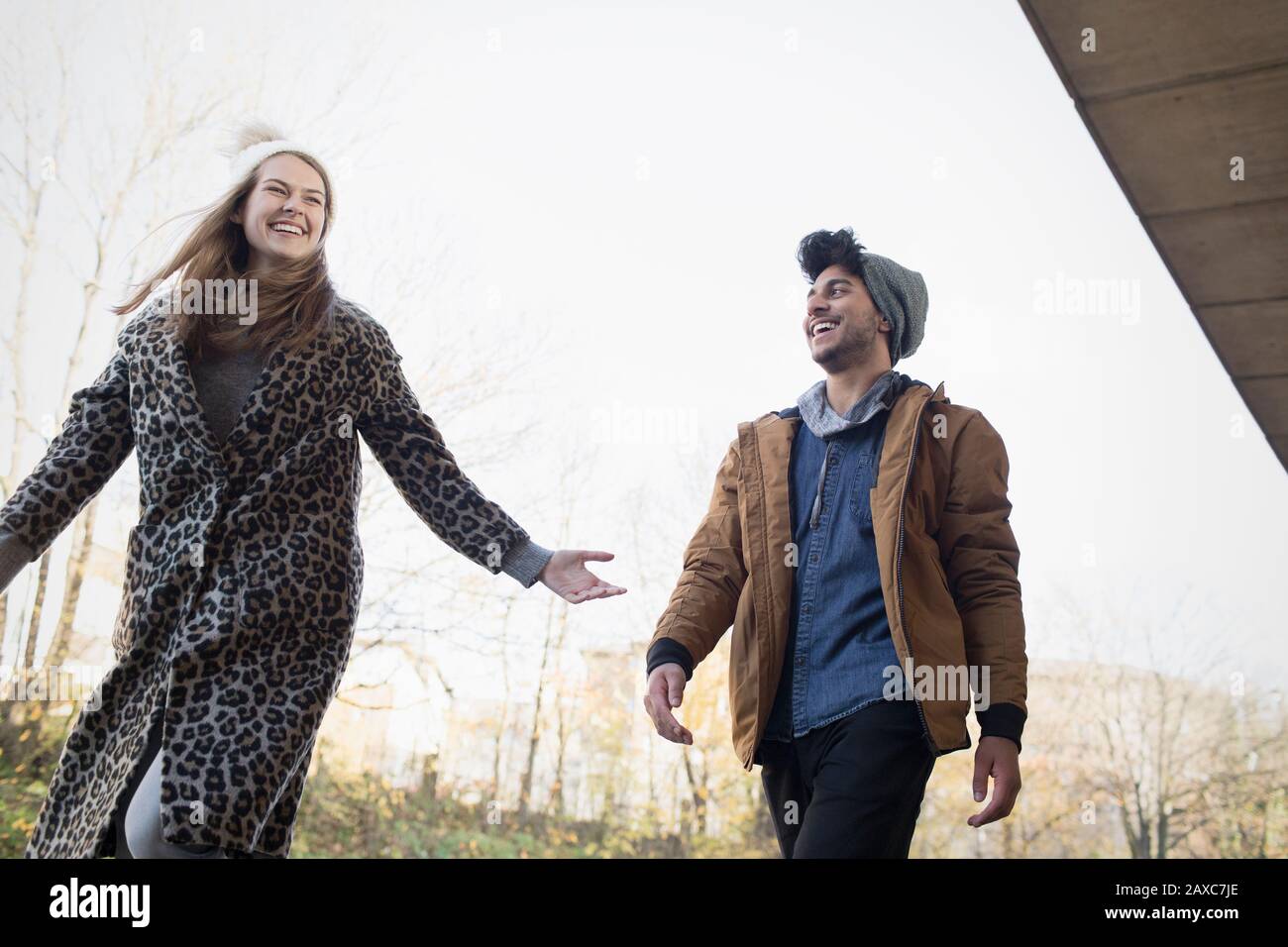Happy young couple in autumn park Stock Photo