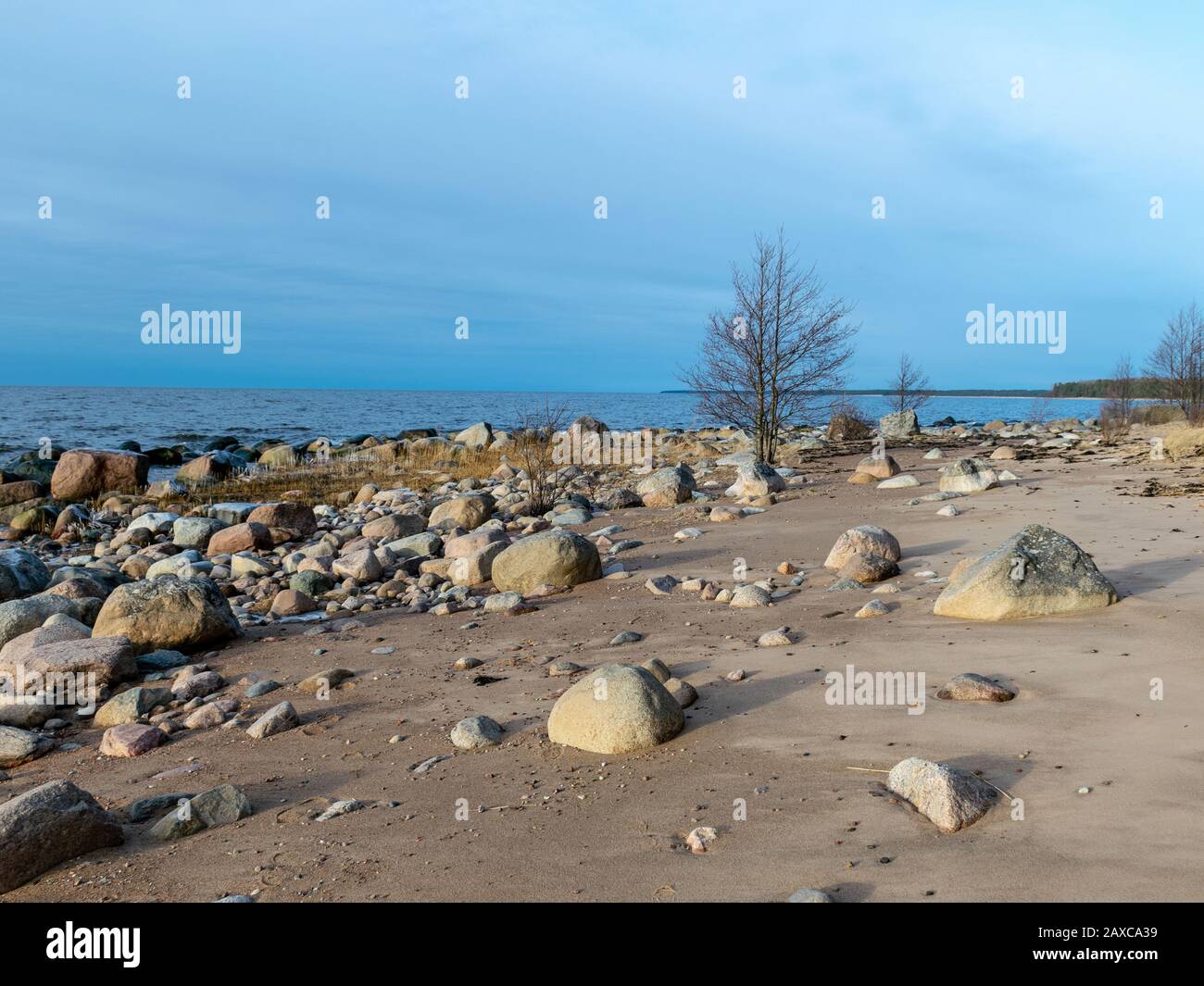 landscape with stony beach, stones of various shapes in the sea Stock ...