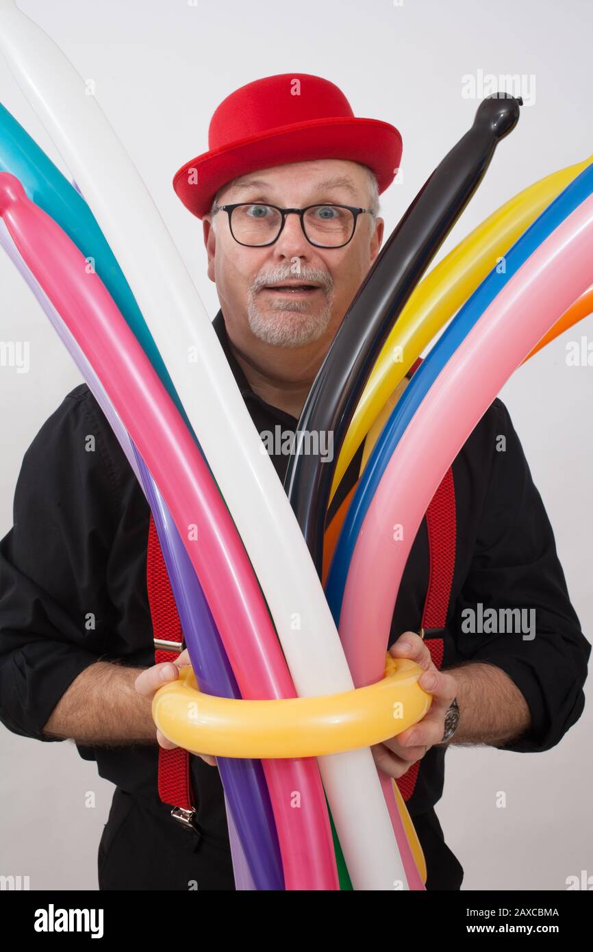 A children's entertainer doing tricks with balloons Stock Photo