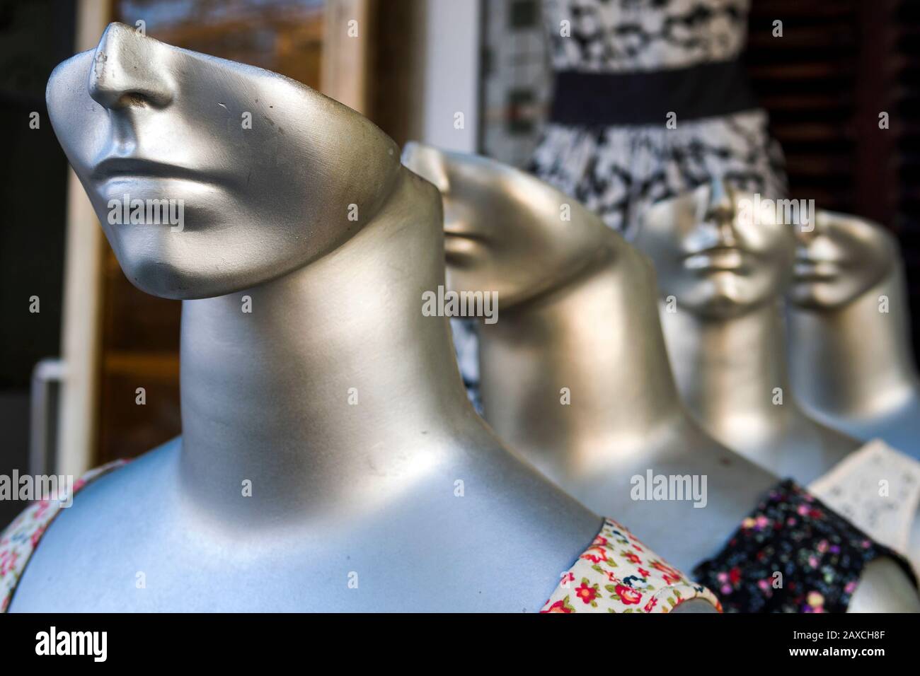 Row of mannequins in clothing / tailor store in Hoi An, Central Vietnam. Stock Photo