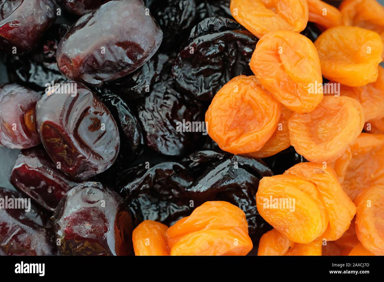 Dried apricots, prunes and dates top view. Delicious turkish dried