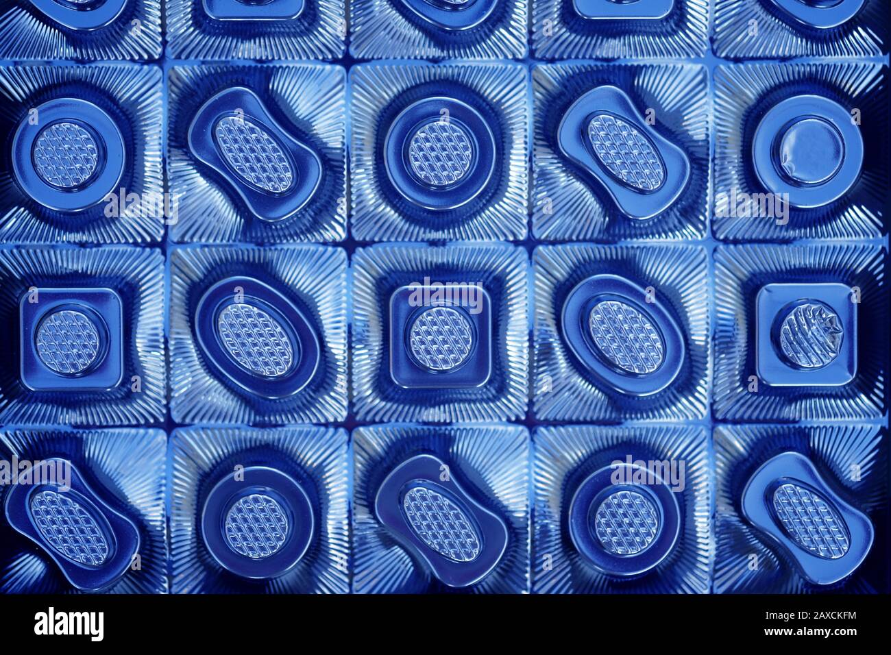 The texture of the plastic packaging of chocolates top view. Empty