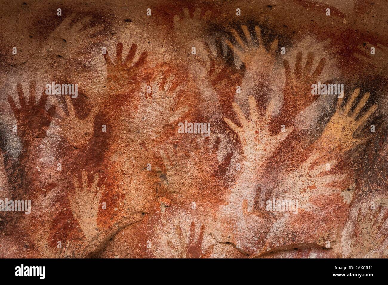 Prehistoric paintings of hands at the Cave of Hands (Spanish: Cueva de Las Manos) in Santa Cruz Province, Patagonia, Argentina. Stock Photo