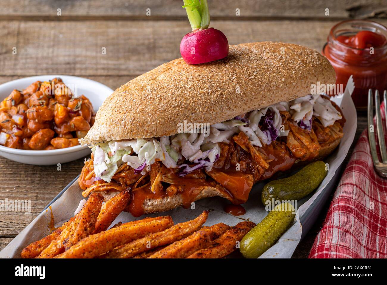 Vegan sandwich. Whole wheat hoagie bread with BBQ jackfruit and