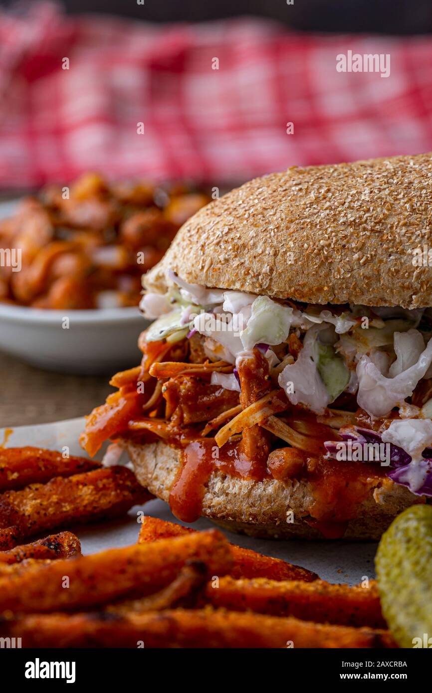 Vegan sandwich. Whole wheat hoagie bread with BBQ jackfruit and