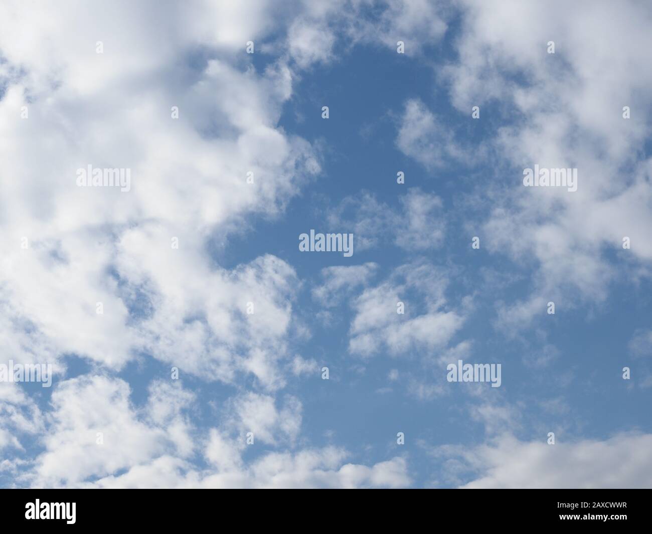 blue sky with clouds useful as a background Stock Photo - Alamy