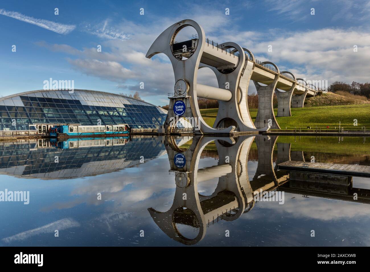 The Falkirk Wheel is a unique rotating boat lift in Scotland, connecting the Forth and Clyde Canal with the Union Canal. It opened in 2002. Stock Photo