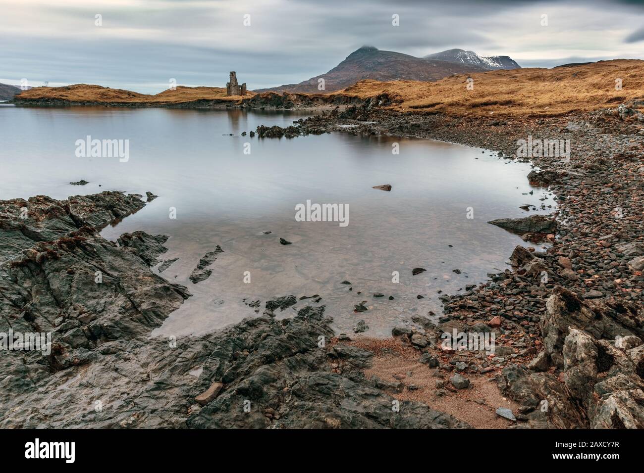 The ruins of 16th century Ardvreck Castle beside Loch Assynt in Sutherland in the Scottish Highlands Stock Photo