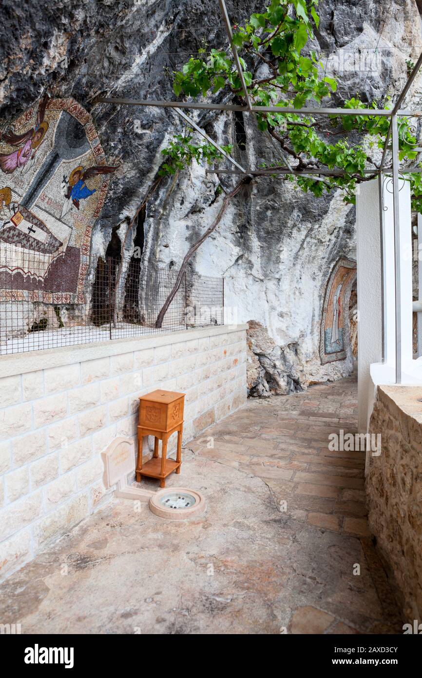 OSTROG, MONTENEGRO-CIRCA JUN, 2016: Passage to Church of the Presentation in  Ostrog monastery. Beautiful painting is on the wall. It is a monastery of  Stock Photo - Alamy, image size:866x1390