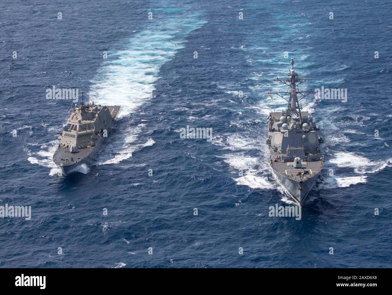 The U.S. Navy Arleigh Burke-class guided-missile destroyer USS Gridley, right, and the Freedom-variant littoral combat ship USS Detroit conduct maneuvering exercises during operations January 4, 2020 in the Atlantic Ocean. Stock Photo