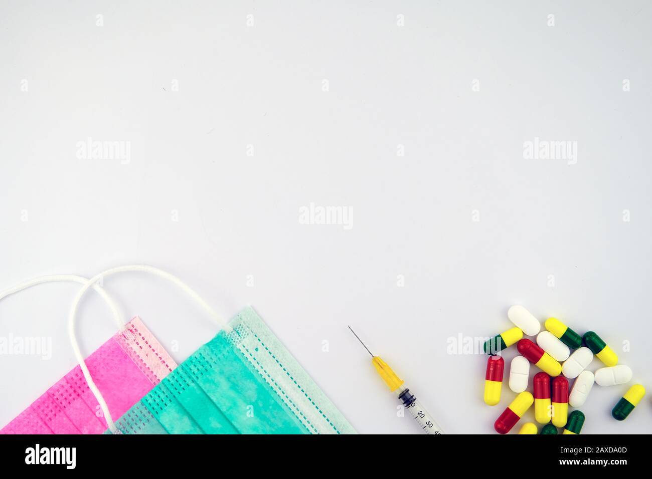 Medical design template with copy space. Viral masks, syringe and pills. Stock Photo