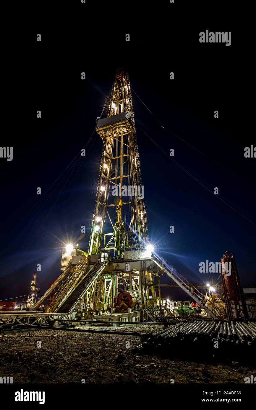 In the evening of oilfield derrick Stock Photo Alamy