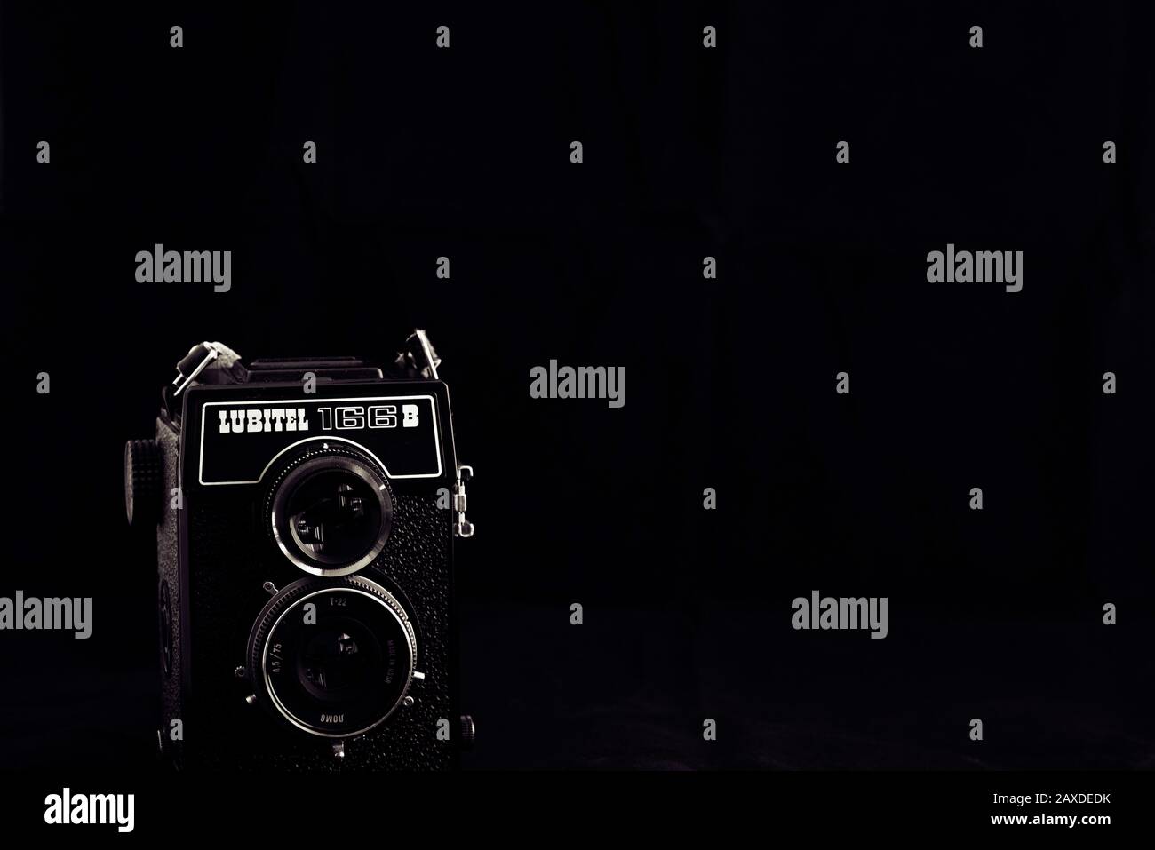 Vintage twin-lens reflex camera, Lubitel 166B, against a dark background. Stock Photo