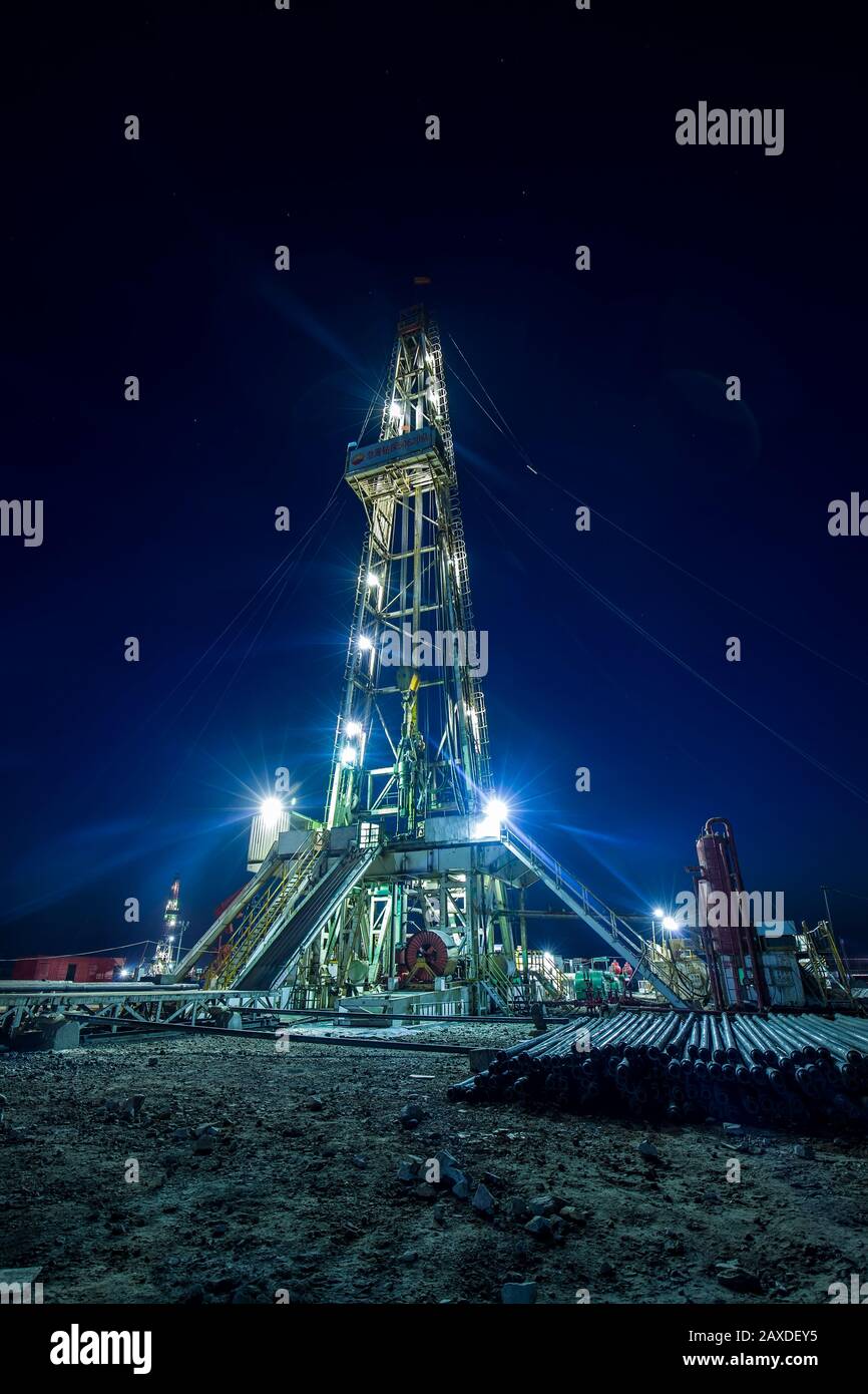 In the evening of oilfield derrick Stock Photo Alamy