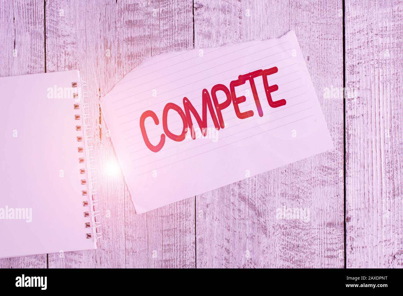 Conceptual hand writing showing Compete. Concept meaning win something by  defeating or establishing superiority over others Torn paper and notebook  sh Stock Photo - Alamy