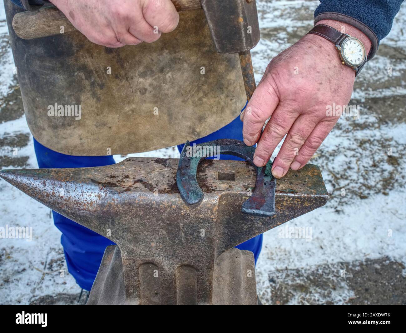 Detail of making new horseshoe in blacksmith Male farrier