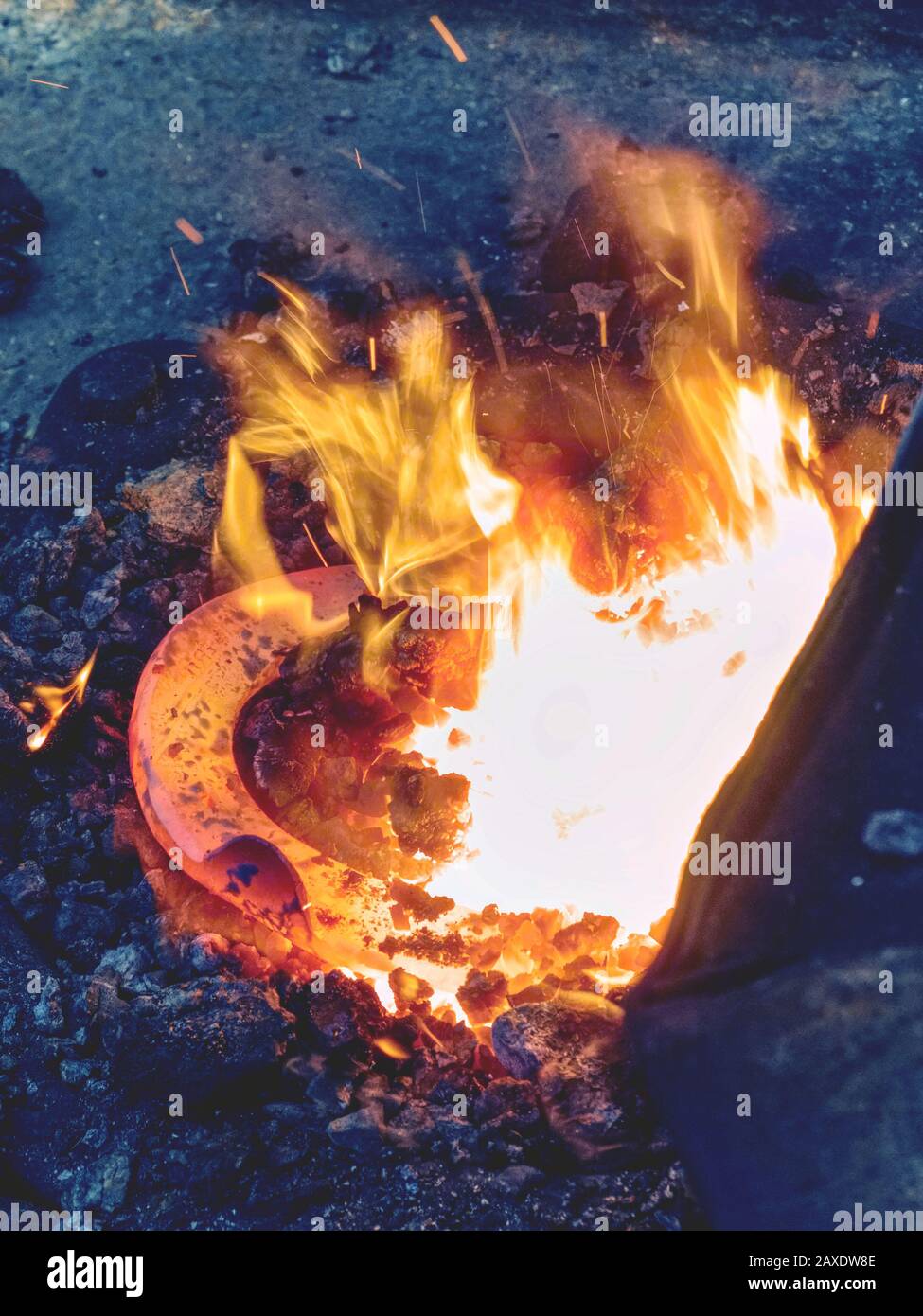 Small mobile blacksmith's with horse hoof inside for heating