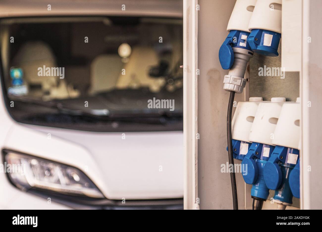 RV Park Camping Electric Pitch Hookups Closeup. Motorhome in the