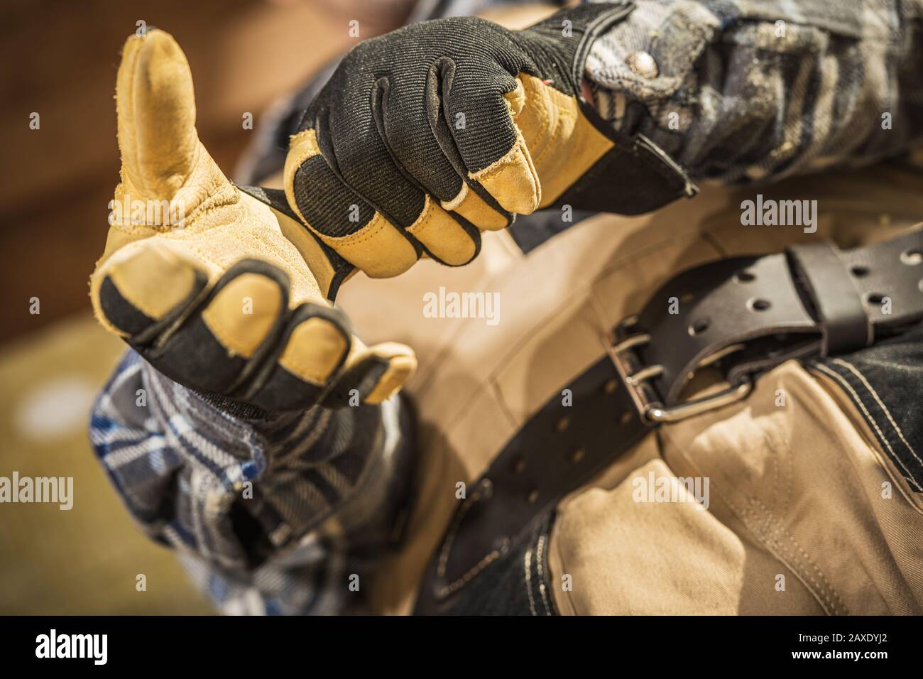 Industrial Theme. Construction Worker Wearing Heavy Duty Safety Gloves. Stock Photo