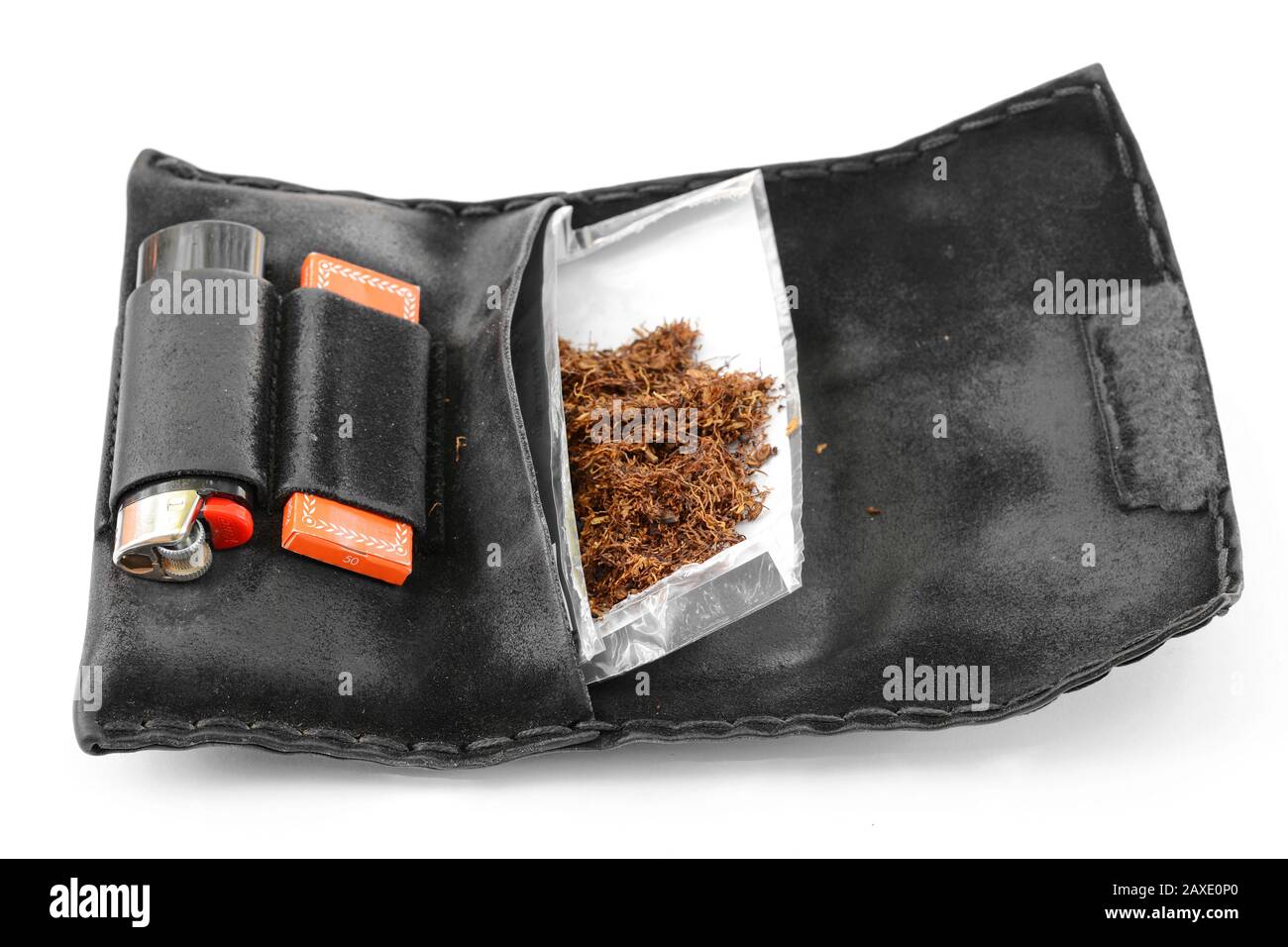 do you need id for cigarette papers tobacco, a lighter and a cigarette paper in the bag Stock Photo