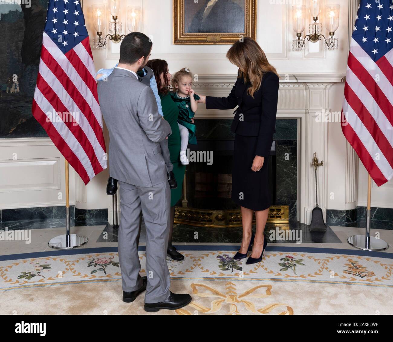 U.S First Lady Melania Trump poses with Robin Schneider, her daughter Ellie Schneider and her husband during a reception for State of the Union gallery guests in the Diplomatic Reception Room of the White House February 4, 2020 in Washington, DC. Stock Photo