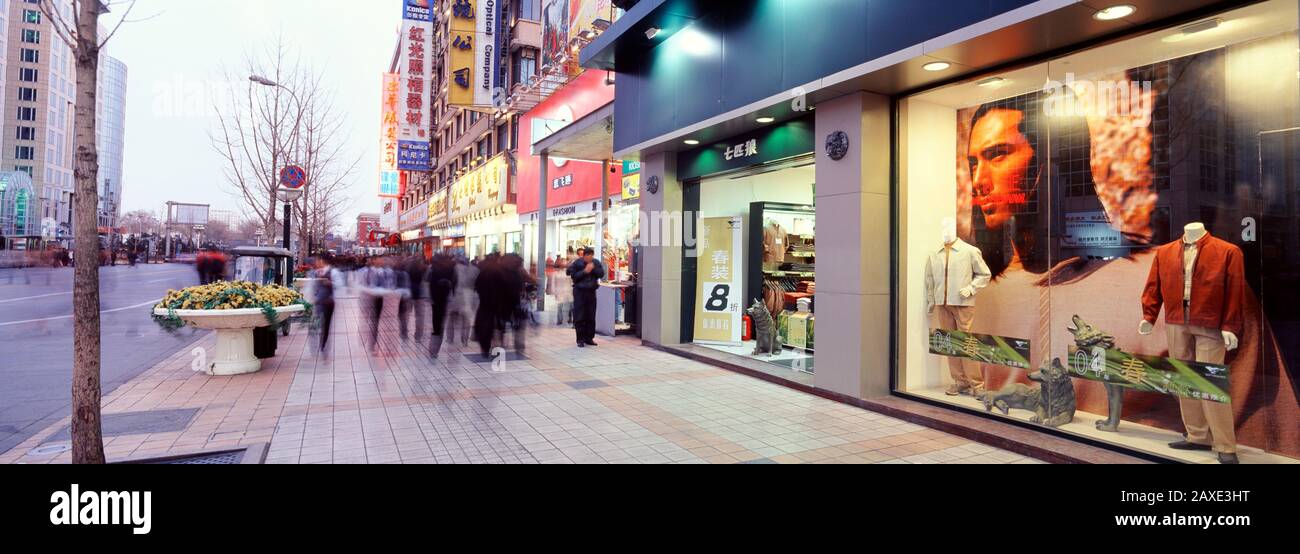 Group of people walking on the road side, Wangfujing, Beijing, China