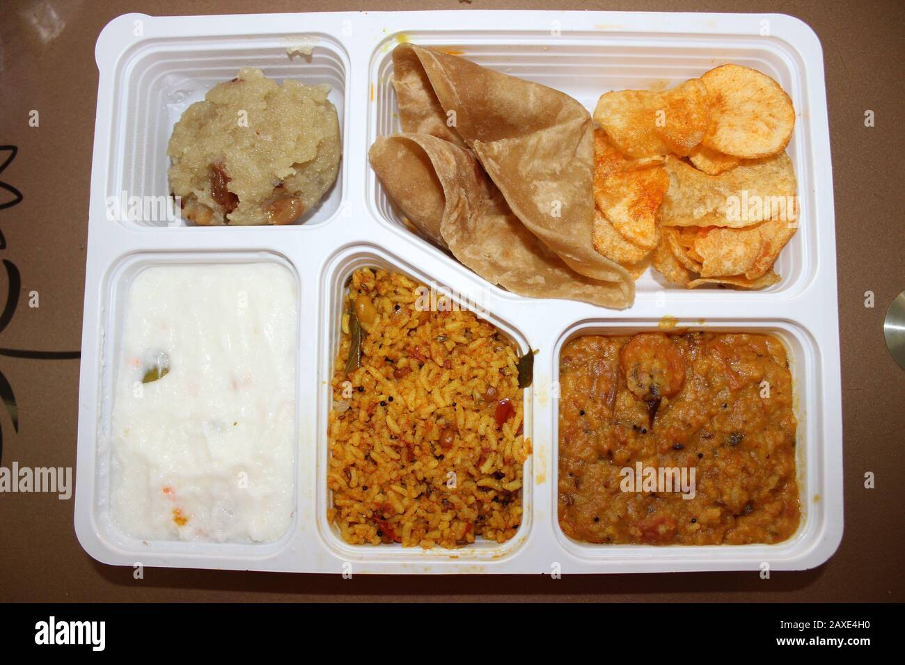 English: Veg Mini Meals in Tamil Nadu served with Sambar rice,Tamarind  rice, Curd rice, Sweet Pongal,Chappathi with gravy and chips.; 22 November  2014, 13:41:45; Own work; KARTY JazZ Stock Photo - Alamy